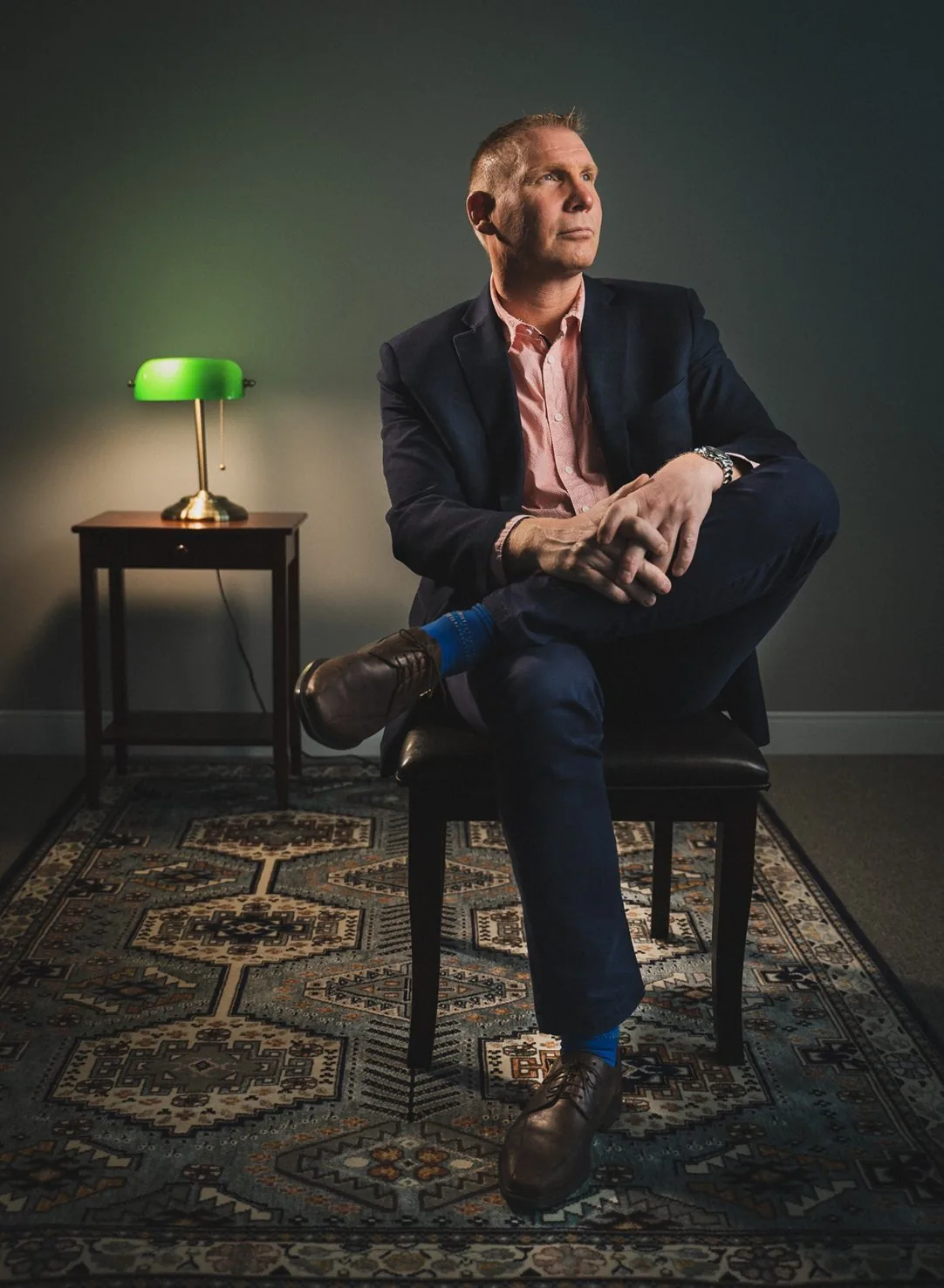 Editorial portrait of a businessman in a styled interior